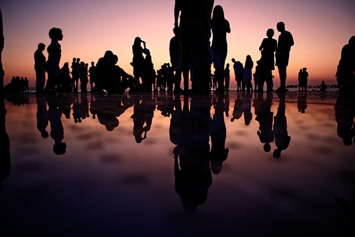 A group gathered outdoors in conversation