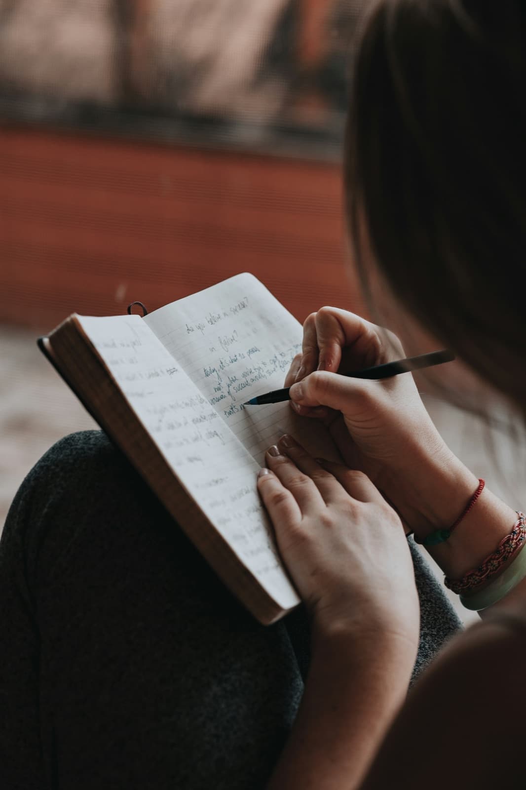 A person journaling during a quiet moment of reflection